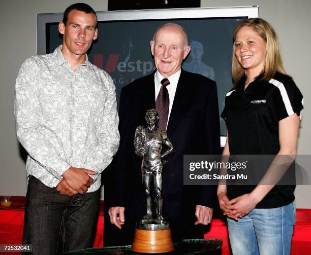 New Zealand Kayaker Ben Fouhy, Sir Murray Halberg and New Zealand runner Kate McIlroy pose with the trophy after the Halberg Trust announced Westpac...
