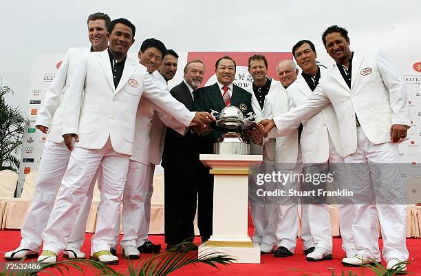 The team of International players celebrate their victory with Sir Terry Matthews OBE, Chairman of The Celtic Manor Resort and Doctor David Chu,...