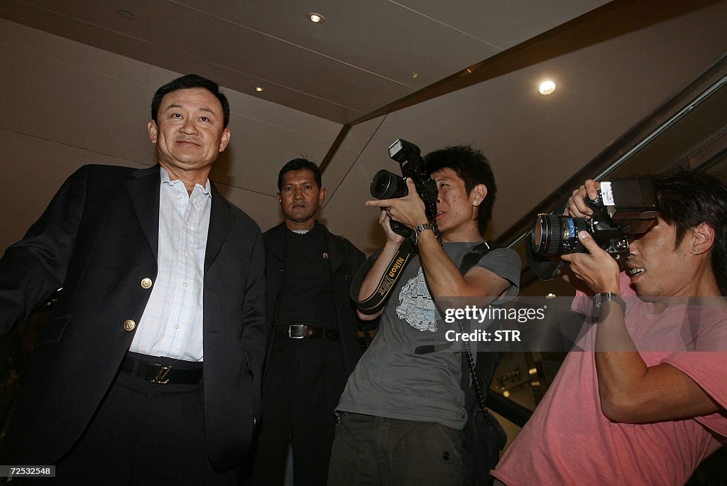 Deposed Deposed Thai prime minister Thaksin Shinawatra is pictured by press ...