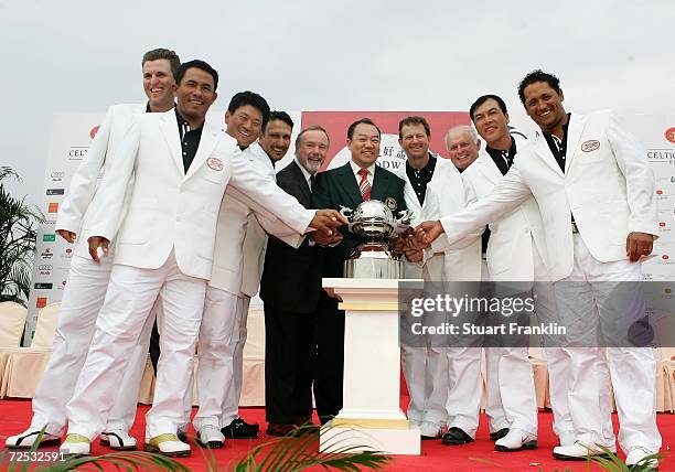 The team of International players celebrate their victory with Sir Terry Matthews OBE, Chairman of The Celtic Manor Resort and Doctor David Chu,...