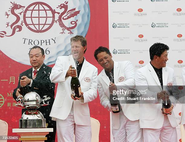 Retief Goosen, Captain of The International team celebrates with champagne with Michael Campbell of New Zealand, K.J Choi of Korea and Doctor David...