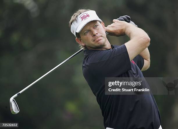 Retief Goosen, Captain of The International team plays his approach shot on the fourth hole during the second day of The Goodwill Trophy at Mission...