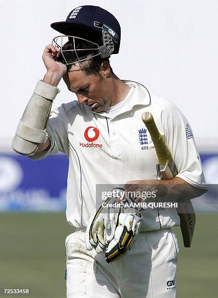 England cricketer Marcus Trescothick walks back to the pavillion after he was dismissed by Pakistani bowler Shabbir Ahmed during the third day of the...