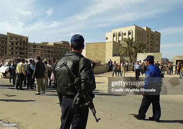 Iraqis gather for news of their relatives kidnapped from an Iraqi Higher Education building by gunmen on November 14, 2006 in Baghdad, Iraq. At least...