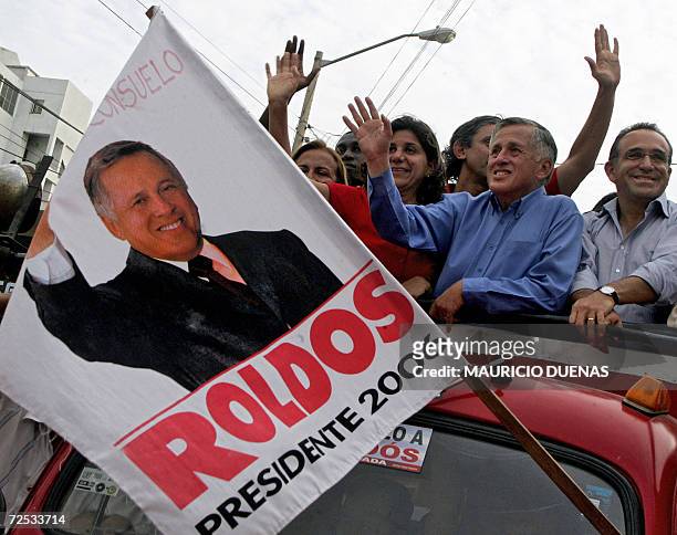 Presidential candidate Leon Roldos waves at his supporters on the campaigns' closing day 12 October in Guayaquil, Guayas Province, Ecuador. According...
