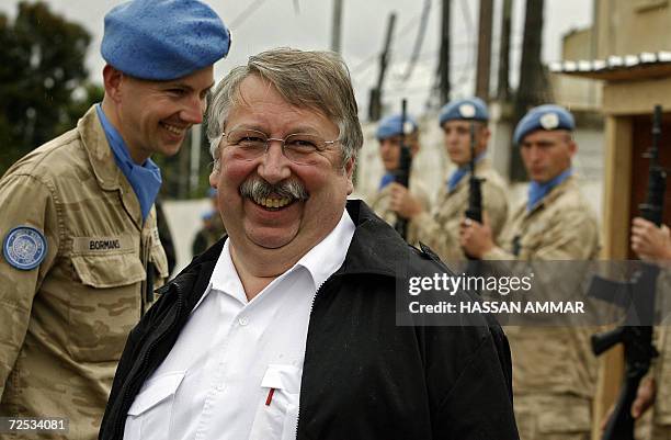 Belgian Defense Minister Andre Flahaut reviews Belgian UN troops in the village of Tebnin, 14 November 2006. Belgium has more than 300 troops serving...