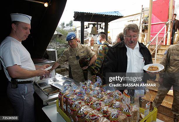 Belgian Defense Minister Andre Flahaut prepares to have lunch with his troop at their base in the village of Tebnin, 14 November 2006. Belgium has...