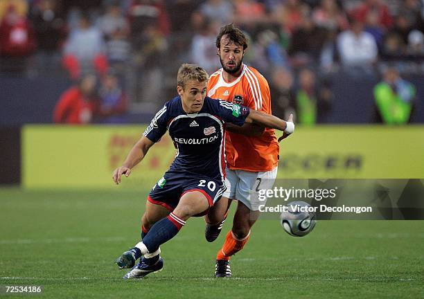 Taylor Twellman of the New England Revolution and Eddie Robinson of the Houston Dynamo vie for the ball during the 2006 MLS Cup at Pizza Hut Park on...