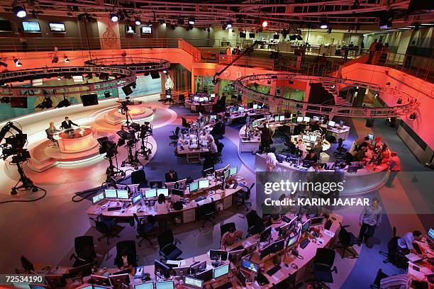 General view shows the newsroom at the headquarters of the Qatar-based Al-Jazeera satellite news channel in Doha 14 November 2006. The...