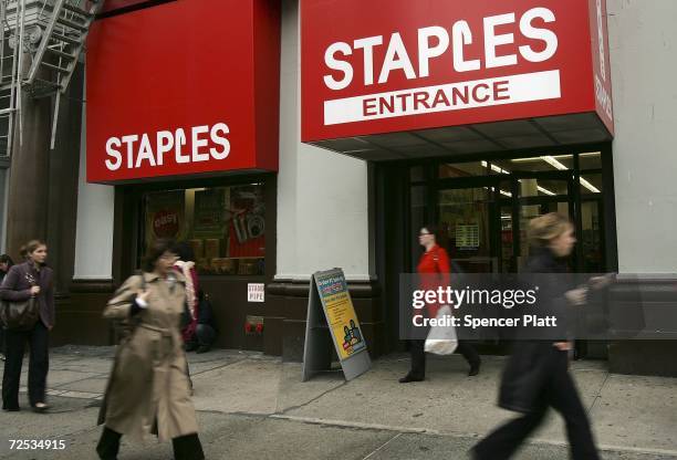 Pedestrians pass a Staples store November 14, 2006 in New York City. Driven by strong back-to-school sales, Staples Inc., the nation's largest office...