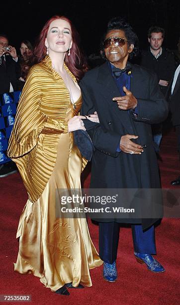 Legendary soul singer James Brown arrives with Tomi Rae Hynie at the UK Music Hall Of Fame 2006, at Alexandra Palace on November 14, 2006 in London,...