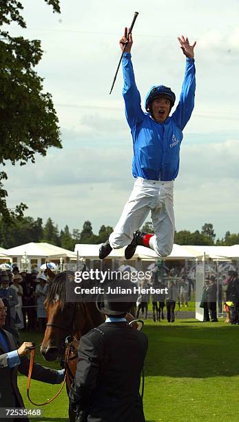 Frankie Dettori leaps from The Godolphin trained Refuse To Bend after landing The Queen Anne Stakes race run at Ascot Racecourse on June 15, 2004 at...
