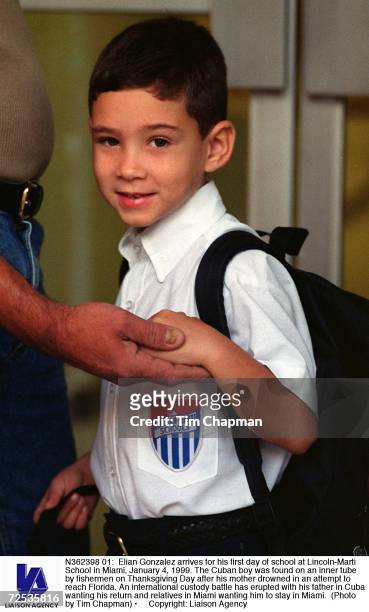 Elian Gonzalez arrives for his first day of school at Lincoln-Marti School in Miami, January 4, 1999. The Cuban boy was found on an inner tube by...