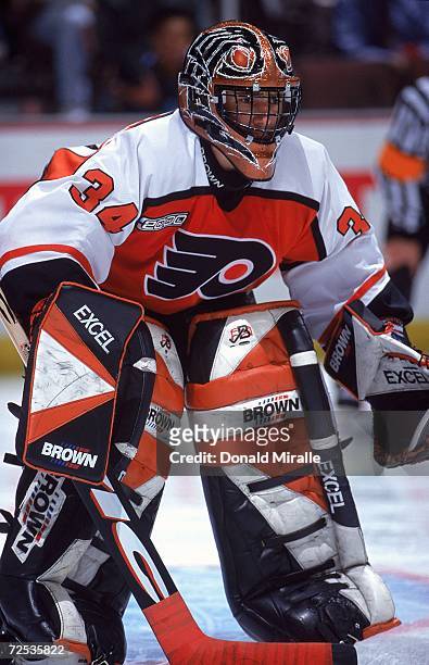 Goalie John Vanbiesbrouck of the Philadelphia Flyers is ready for the puck during the game against the Anaheim Mighty Ducks at the Arrowhead Pond in...
