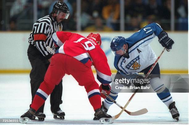 Jari Kurri of Finland and Alexei Yashin of Russia face off at Big Hat Arena during the 1998 Winter Olympic Games in Nagano, Japan. Mandatory Credit:...