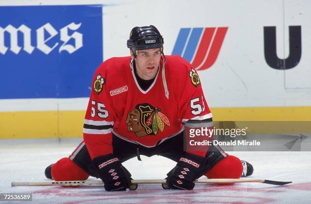 Eric Daze of the Chicago Blackhawks stretches on the ice during the game against the Los Angeles Kings at Staples Center in Los Angeles, California....