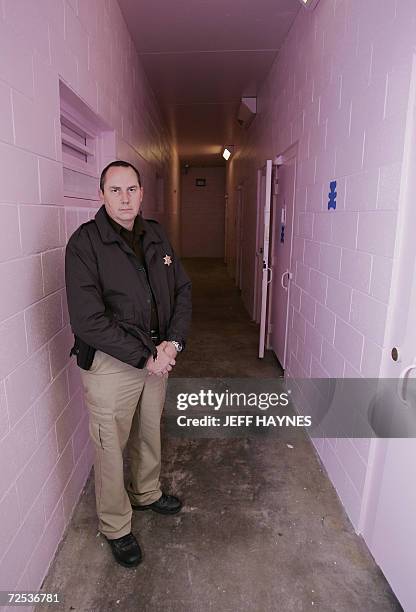 Buffalo, UNITED STATES: Dallas County Sheriff Mike Rackley stands in the hallway 14 November 2006 of his newly painted county jail with the color...