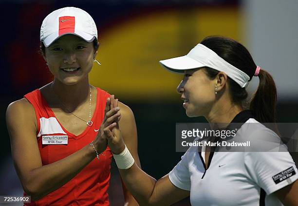 Zi Yan and Jie Zheng of China celebrate their win over Alina Jidkova of Russia and Tatiana Perebeynis of the Ukraine during day five of the Moorilla...