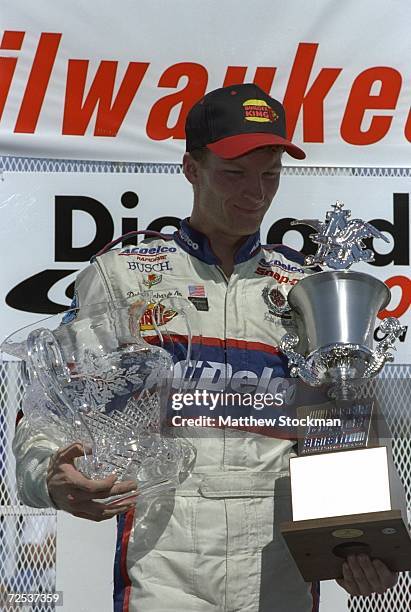 Driver Dale Earnhardt Jr. #3 poses with the trophy after winning the Diehard 250- Milwaukee Mile in West Allis, Wisconsin. Mandatory Credit: Matthew...