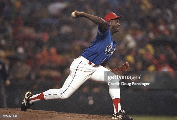 Pitcher Jose Contreras of Team Cuba winds up for the pitch during the game against the Baltimore Orioles at the Camden yards in Baltimore, Maryland....