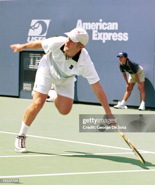 Tennis star John McEnroe plays a charity match at the Arthur Ashe Kid's Day Family and Music Festival August 26, 2000 at the USTA National Tennis...