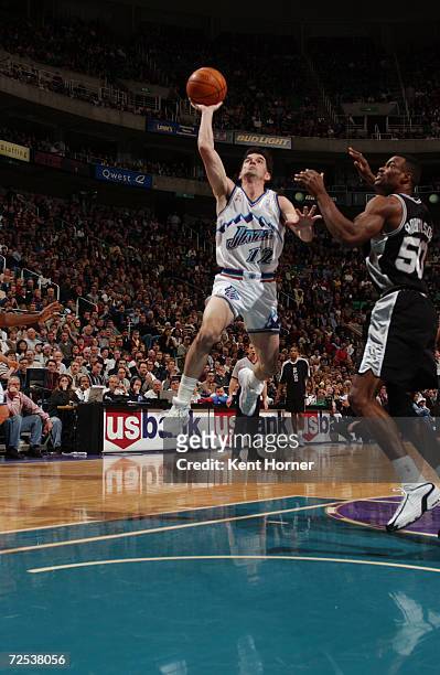 John Stockton of the Utah Jazz goes to the basket against David Robinson of the San Antonio Spurs during their game at Delta Center in Salt Lake...