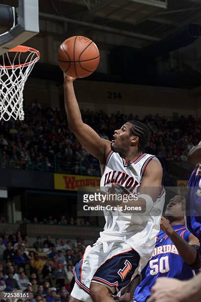 Forward Sergio McClain of the Illinois Fighting Illini goes up with the ball as center Udonis Haslem of the Florida Gators looks on during Florida''s...