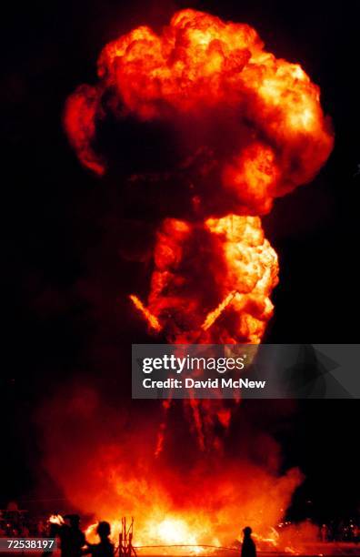 Fireball billows up from a 52-foot tall wooden man as it goes up in flames September 2, 2000 during the15th annual Burning Man festival in the Black...