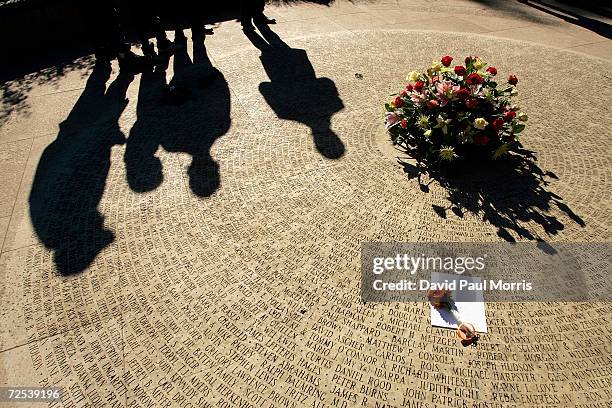 People attend World Aids Day Ceremony at the National Aids Memorial Grove in Golden Gate Park on December 1, 2004 in San Francisco, California....