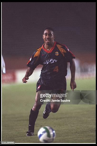 Robin Fraser of the Los Angeles Galaxy moves the ball against the New England Revolution during an MLS game played at the Rose Bowl in Pasadena,...