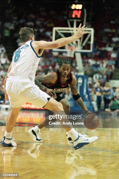 Allen Iverson of the Philadelphia 76ers dribbles the ball during the game against the Orlando Magic at the Orlando Arena in Orlando, Florida. The...