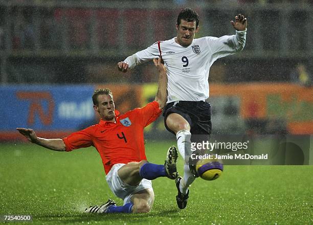 Frank van der Struijk of Holland U21s tackles David Nugent of England U21s during the International Friendly match between Holland U21s and England...