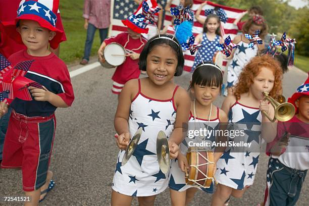 children playing instruments in fourth of july parade - child marching stock pictures, royalty-free photos & images