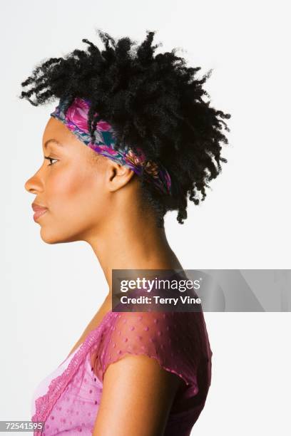 side view studio shot of african woman - locs hairstyle stock pictures, royalty-free photos & images