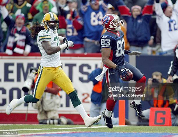 Lee Evans of the Buffalo Bills runs in for a touchdown against Al Harris of the Green Bay Packers on November 5, 2006 at Ralph Wilson Stadium in...