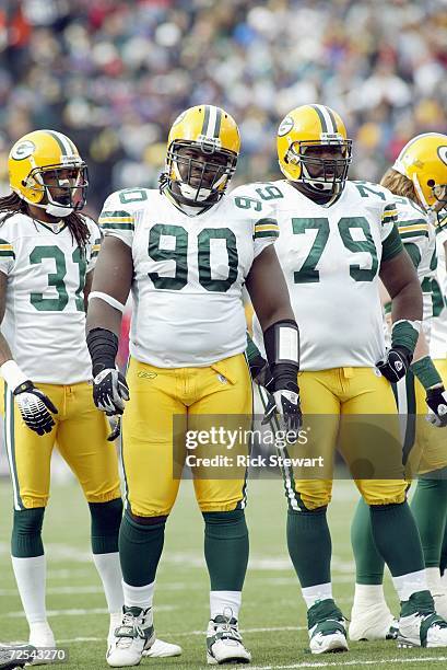 Al Harris, Colin Cole and Ryan Pickett of the Green Bay Packers stand on the field during the game against the Buffalo Bills on November 5, 2006 at...