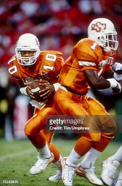 Quarterback Tony Lindsay of the Oklahoma State Cowboys runs with the ball during a game against the Nebraska Cornhuskers at the Arrowhead Stadium in...
