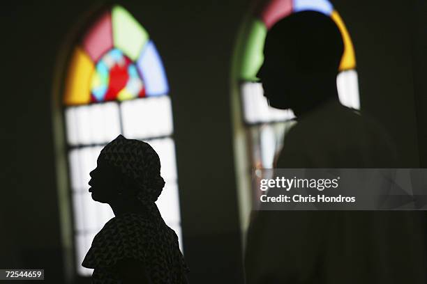 Nigerian Catholic worshippers stand during morning mass April 12, 2005 in Kano, Nigeria. Kano is part of Nigeria's primarily Muslim north, but...