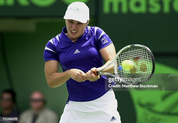 Martina Hingis of Switzerland returns a shot to Anne-Gaelle Sidot of France during the Ericsson Open at The Tennis Center of Crandon Park on Key...