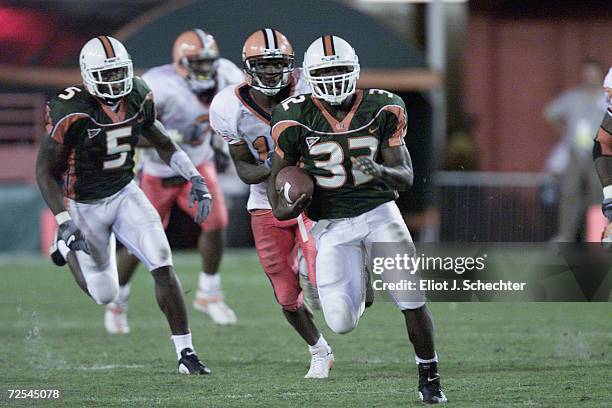 Running back Frank Gore of the Miami Hurricanes runs with the ball during the Big East Conference football game against the Syracuse Orangemen at the...