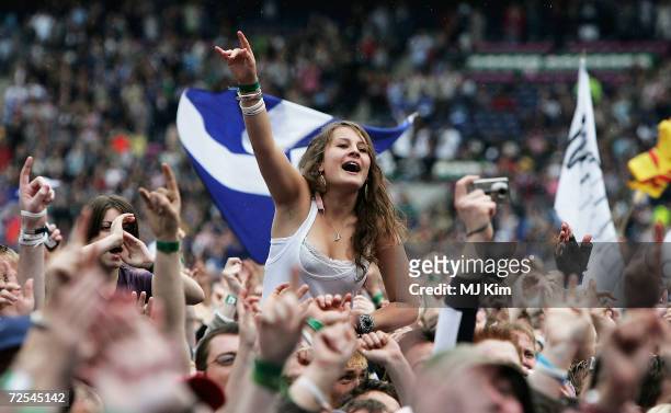 Girl is seen in the crowd at Live 8 Edinburgh concert at Murrayfield Stadium on July 6, 2005 in Edinburgh, Scotland. The free gig, labelled Edinburgh...