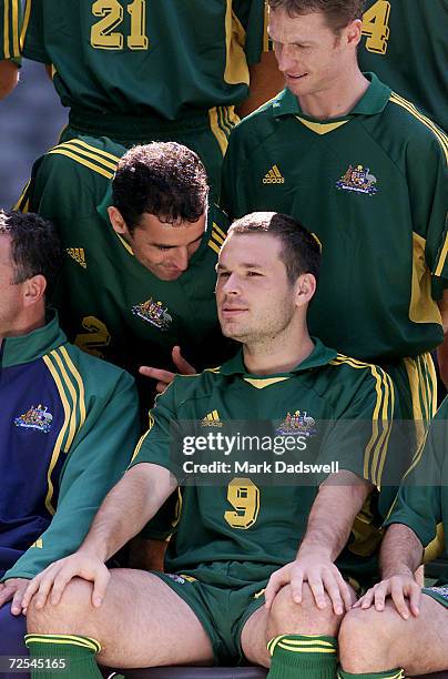 Mark Viduka listens to teammates before a team photo is taken before during a training session at Colonial Stadium, Melbourne, Australia. The...