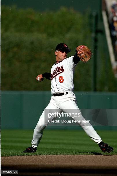 Cal Ripken Jr.#8 of the Baltimore Orioles throws the ball during a game against the Kansas City Royals at Camden Yards in Baltimore, Maryland. The...