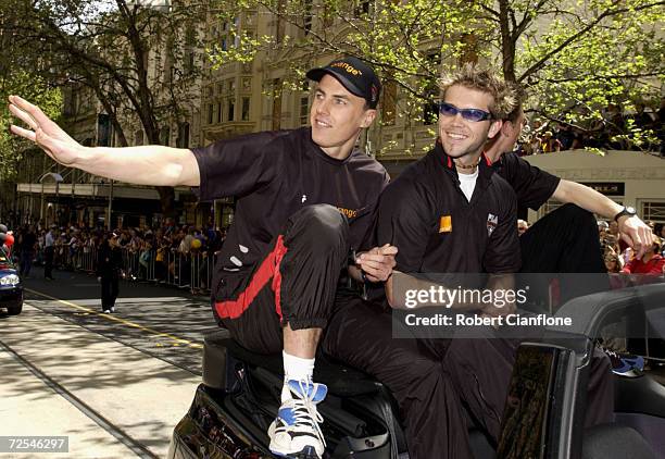 Matthew Llyod and Mark McVeigh of the Essendon Bombers wave to their fans, during the 2001 AFL Grand Final Parade. Melbourne, Australia. DIGITAL...