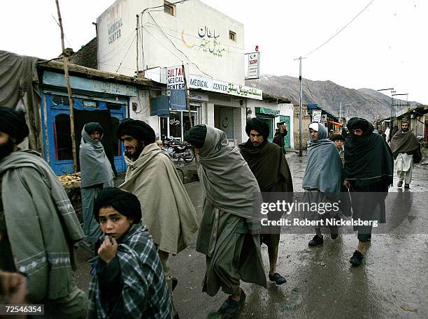 Afghan Taliban walk through one of the main bazaars February 25, 2005 in Quetta, Pakistan. Taliban forces have been taking refuge inside the...