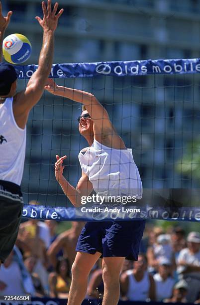 Dax Holdren jumps to hit the ball during the 2000 Oldsmobile Alero Beach Volleyball - US Olympic Challenge Series in Deerfield Beach, Florida....