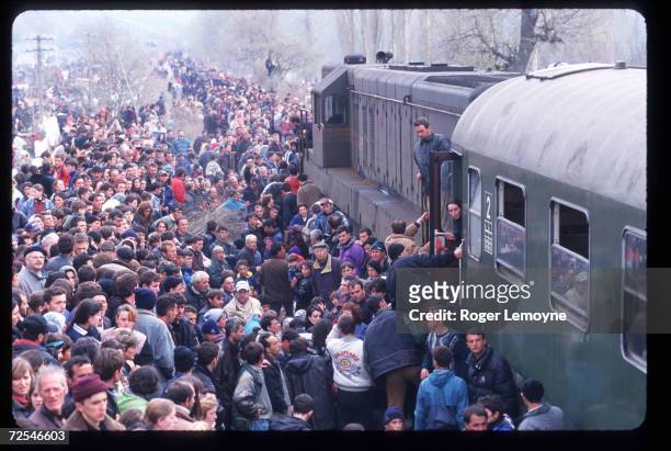 Refugees prepare to board trains April 1, 1999 in Macedonia. Thousands of Kosovar Albanians fled the violence in Serbia and arrived at Blace, a...