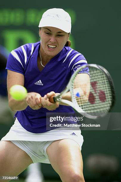 Martina Hingis of Switzerland returns a shot to Anne-Gaelle Sidot of France during the Ericsson Open at The Tennis Center of Crandon Park on Key...