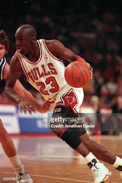 Michael Jordan of the Chicago Bulls dribbles the ball during a game against the Sacremento Kings . Mandatory Credit: Jonathan Daniel /Allsport