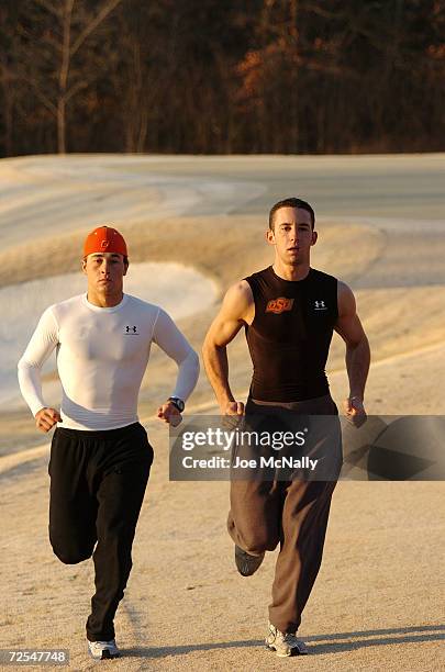 Golfers Casey Wittenberg and Zack Robinson , headliner members of the Oklahoma State golf team, cross-train by running cross-country on a local...